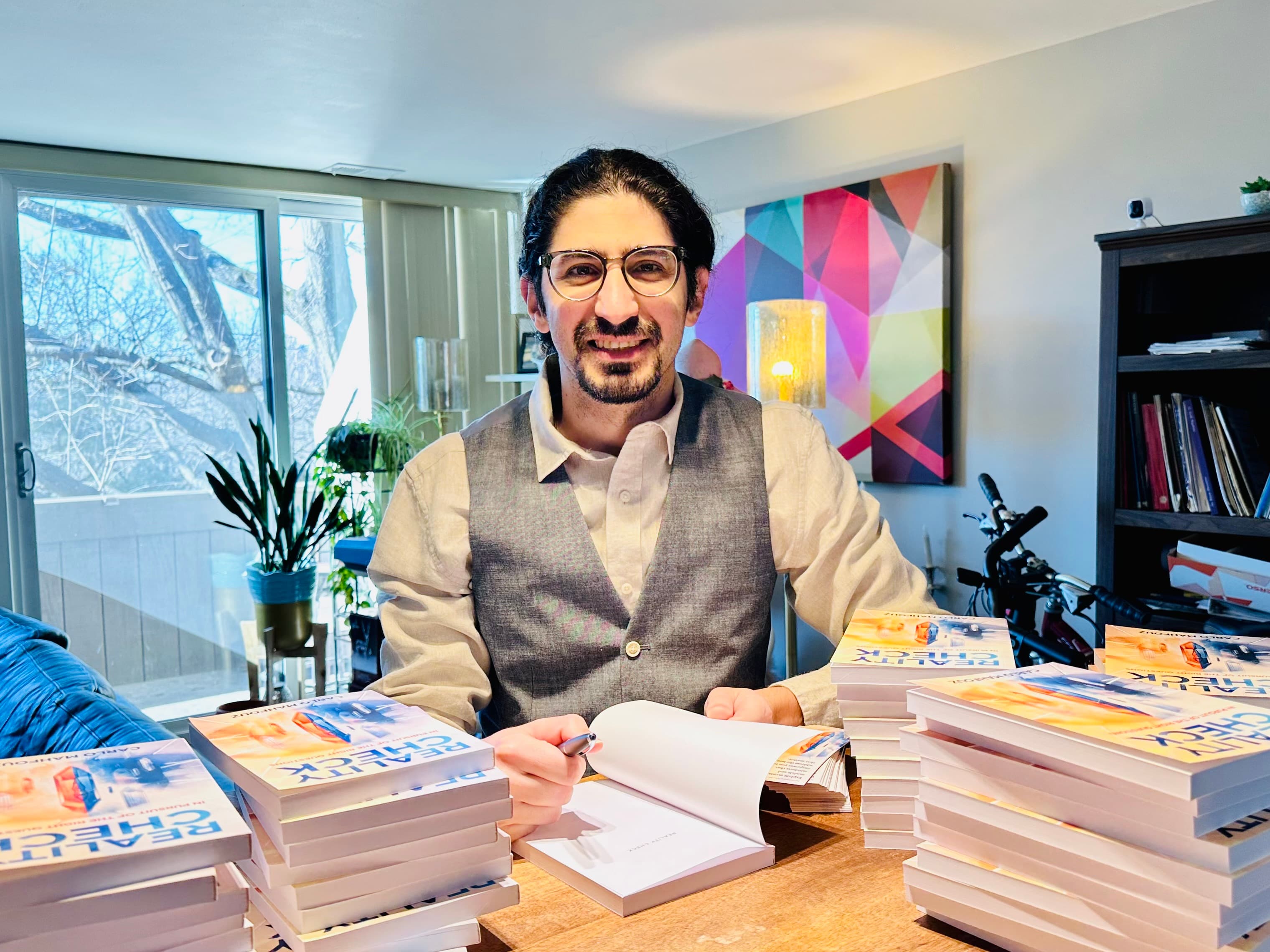 Carlo Mahfouz signing copies of Reality Check